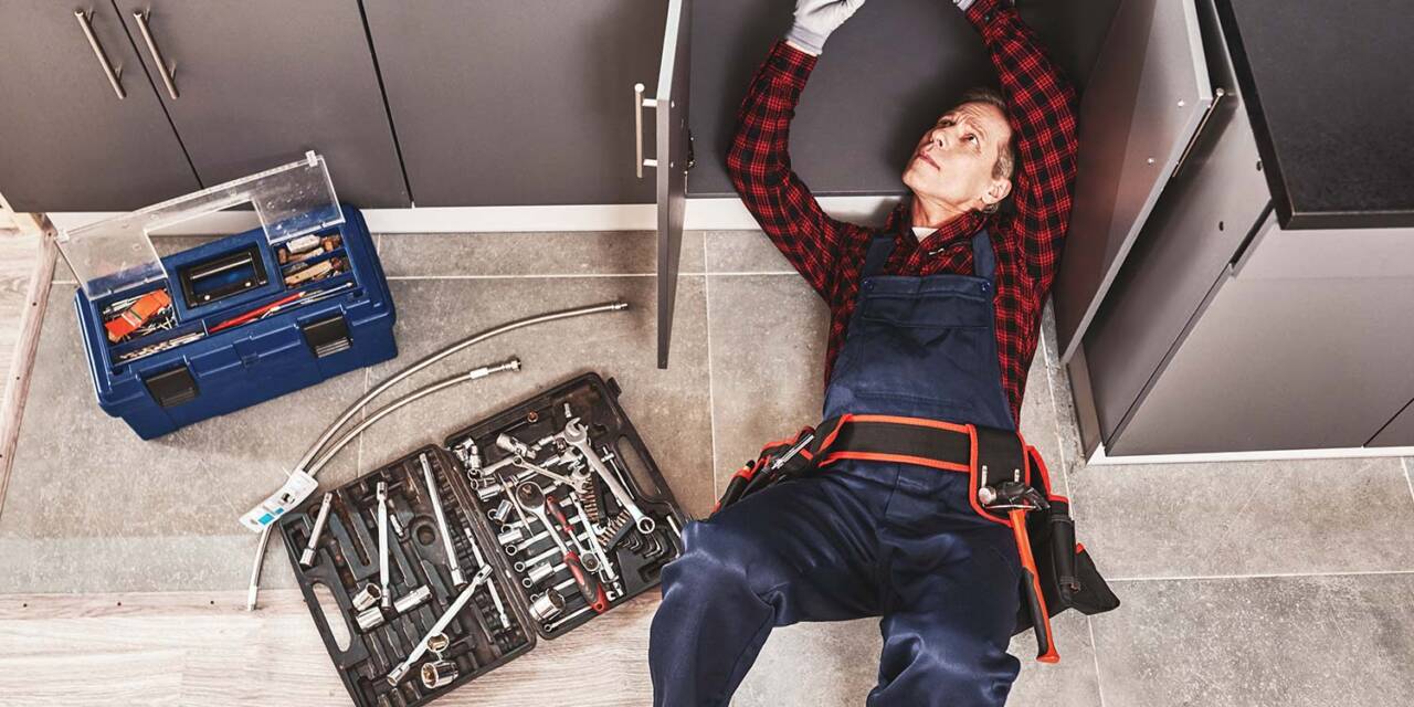 tools-case-top-view-of-seniour-handyman-repairing-resize.jpg